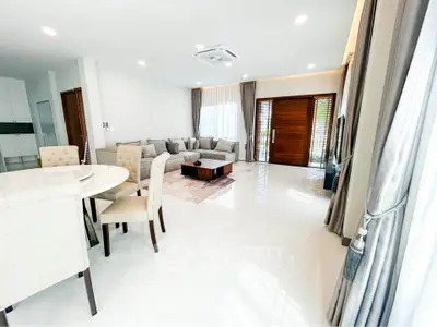 Spacious modern living room with elegant decor and ample natural light