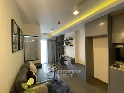 Modern living room with sleek design and cozy ambiance, featuring stylish furniture and contemporary decor.