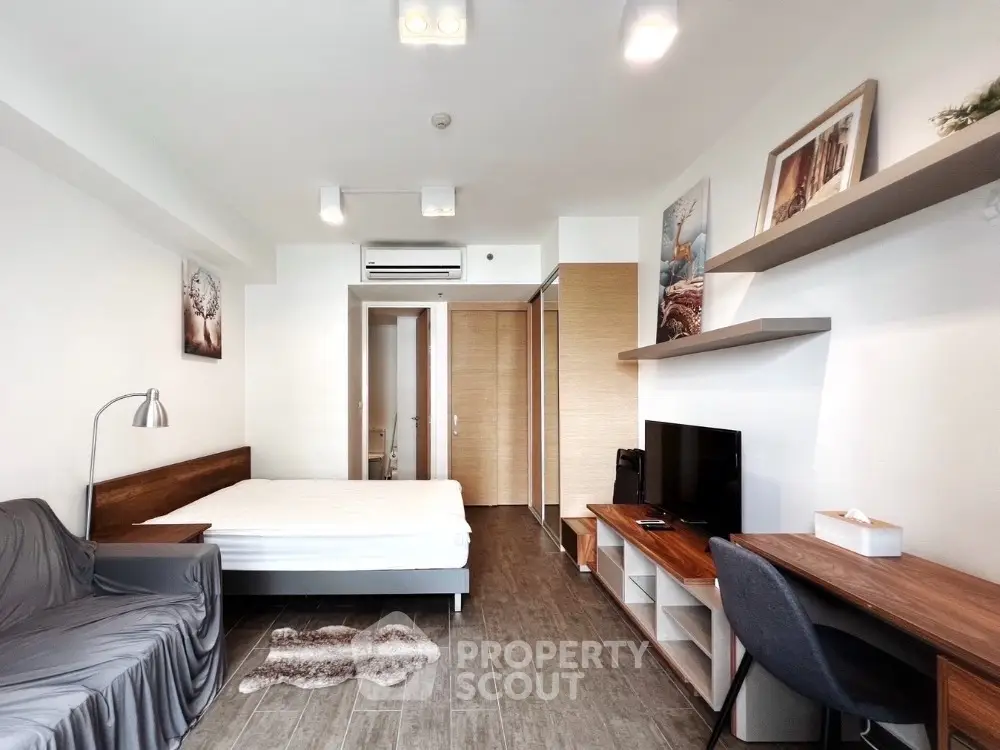 Modern studio apartment with stylish decor and functional furniture