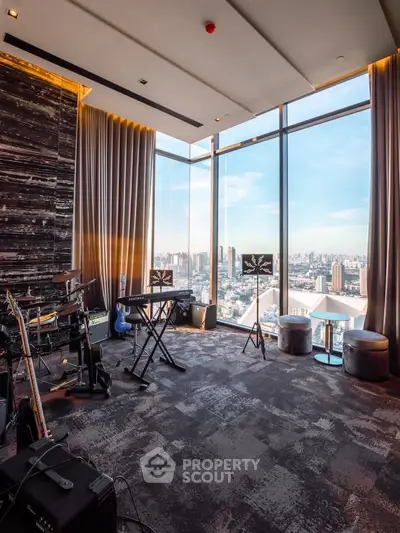 Luxurious high-rise living room with panoramic city views and music setup.