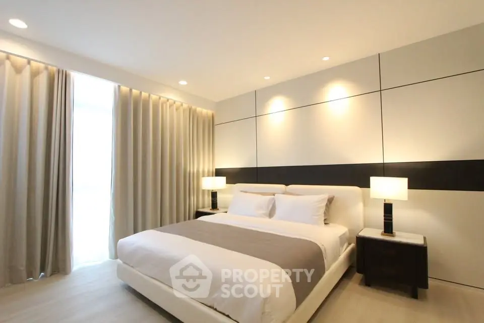 Luxurious modern bedroom with elegant lighting and stylish decor