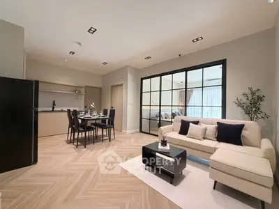 Spacious modern living room with open kitchen and elegant dining area