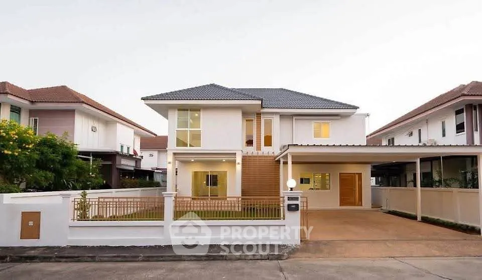 Stunning modern two-story house with spacious driveway and elegant facade in a serene neighborhood.