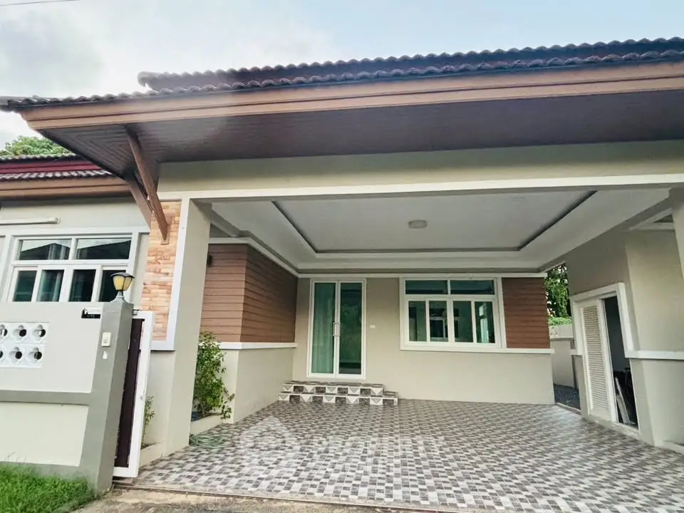 Charming single-story home with covered carport and modern exterior design.