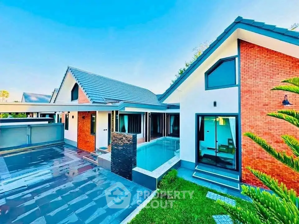 Stunning modern house with sleek design, pool, and spacious outdoor area.