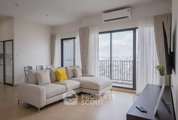 Modern living room with city view and stylish furniture