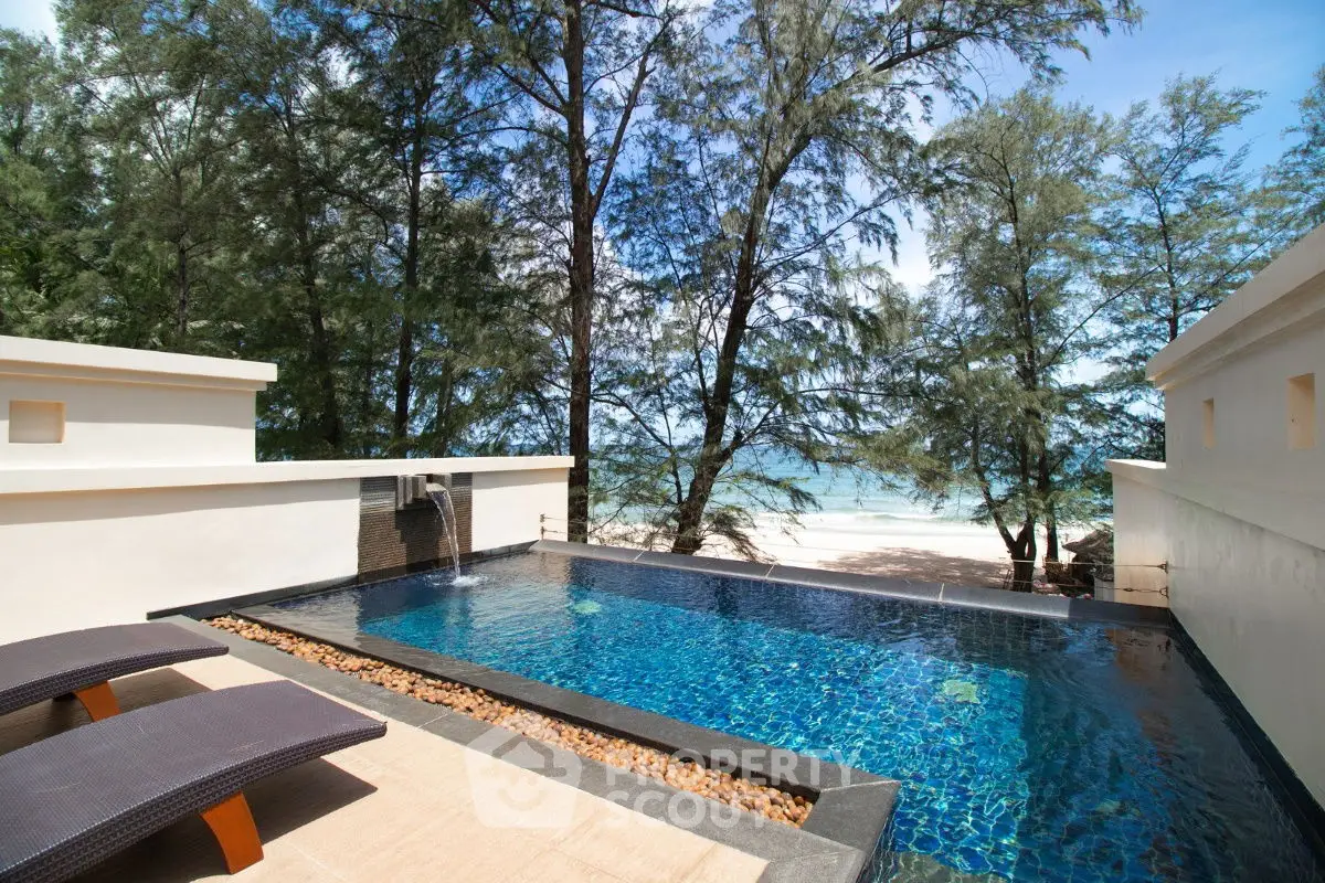 Luxurious beachfront pool with stunning ocean view and modern design.