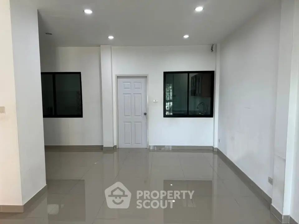 Spacious modern interior with glossy tiled floors and sleek design