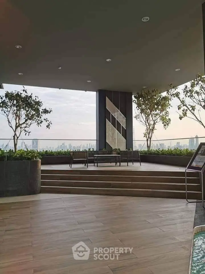 Luxurious rooftop terrace with stunning city skyline views and modern seating area.
