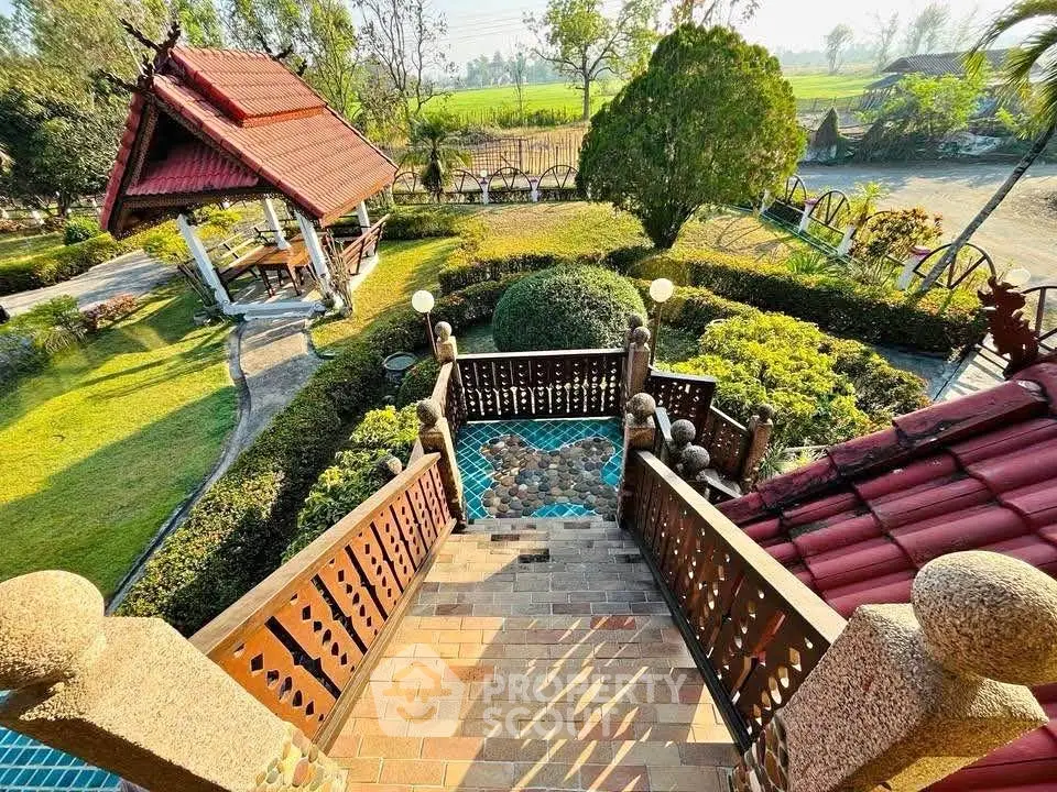 Charming garden view from traditional wooden staircase in serene countryside setting.