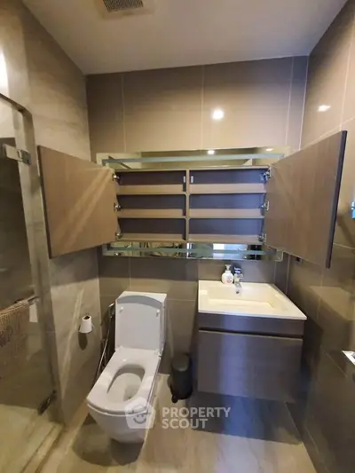 Modern bathroom with sleek fixtures and ample storage space