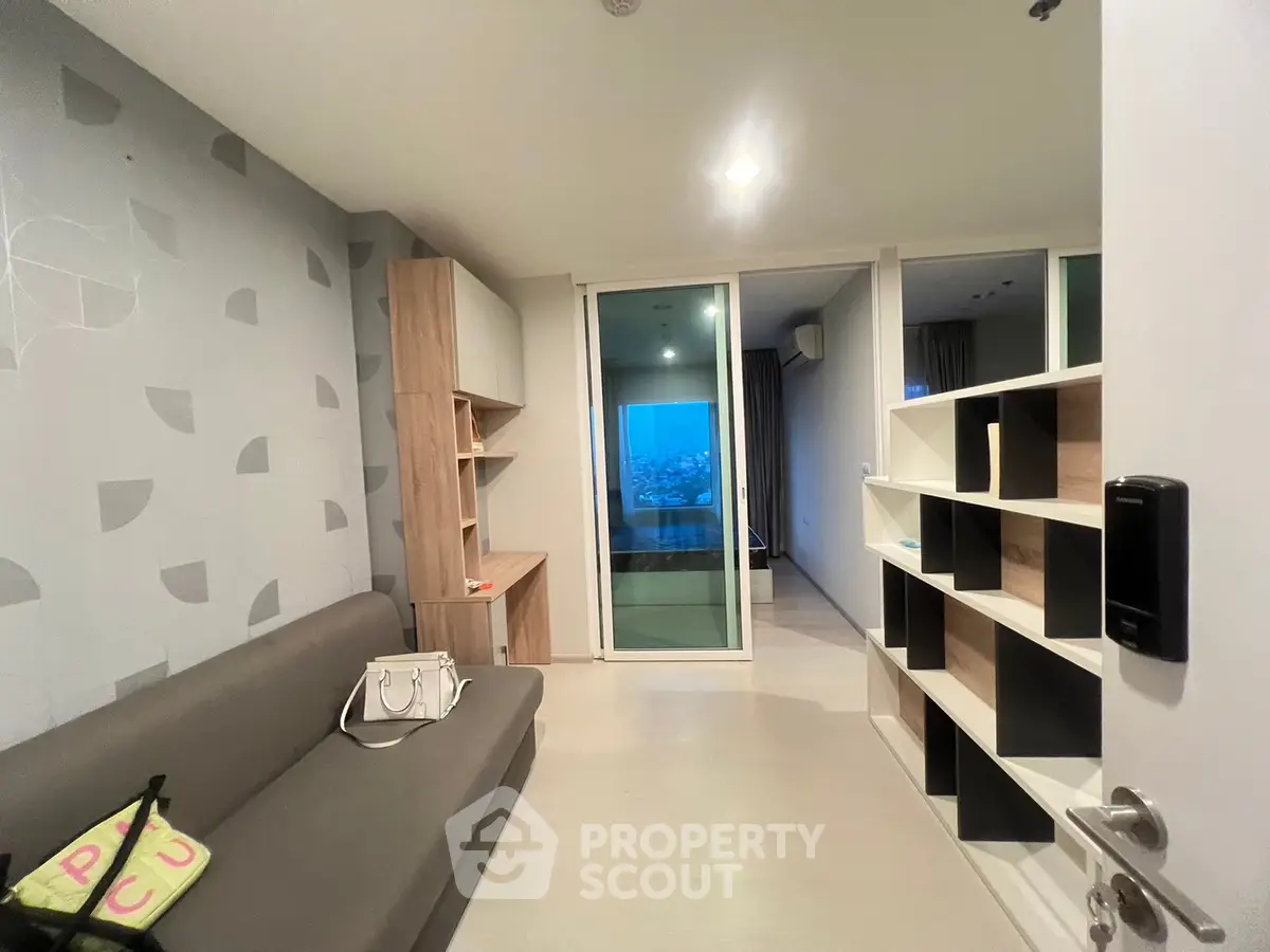 Modern apartment interior with stylish living room and open shelving