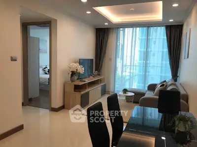 Modern living room with elegant decor and natural light in a high-rise apartment.