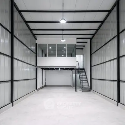 Spacious industrial warehouse with mezzanine and modern lighting