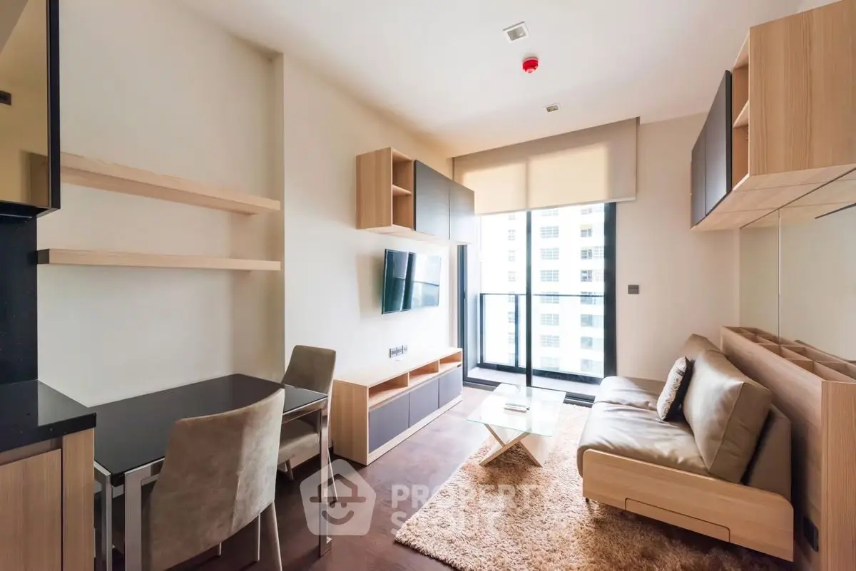 Modern living room with sleek furniture and balcony view in a stylish apartment.