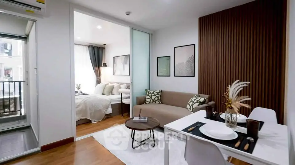 Modern studio apartment with cozy living area and stylish bedroom, perfect for urban living.