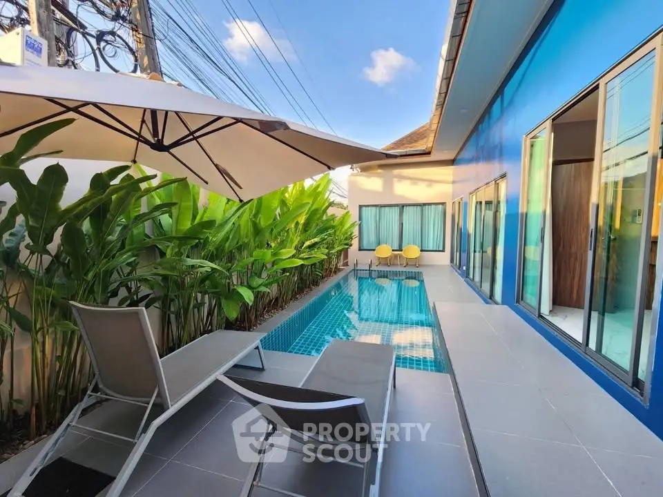 Luxurious private pool area with modern design and lush greenery, perfect for relaxation and entertainment.
