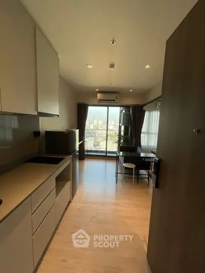 Modern apartment kitchen with open layout and city view