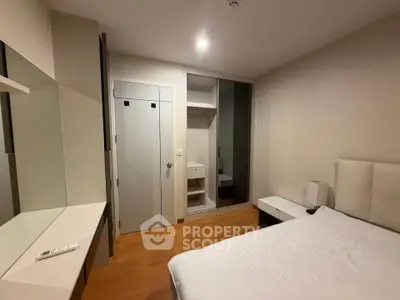 Modern bedroom with sleek design and ample storage space