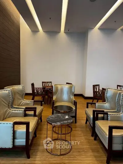 Elegant seating area with stylish chairs and table in modern interior design.