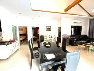 Spacious modern living room with elegant dining area and stylish decor