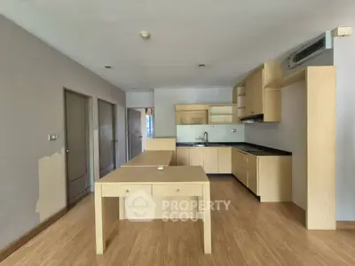 Spacious kitchen with modern wooden cabinetry and open layout design