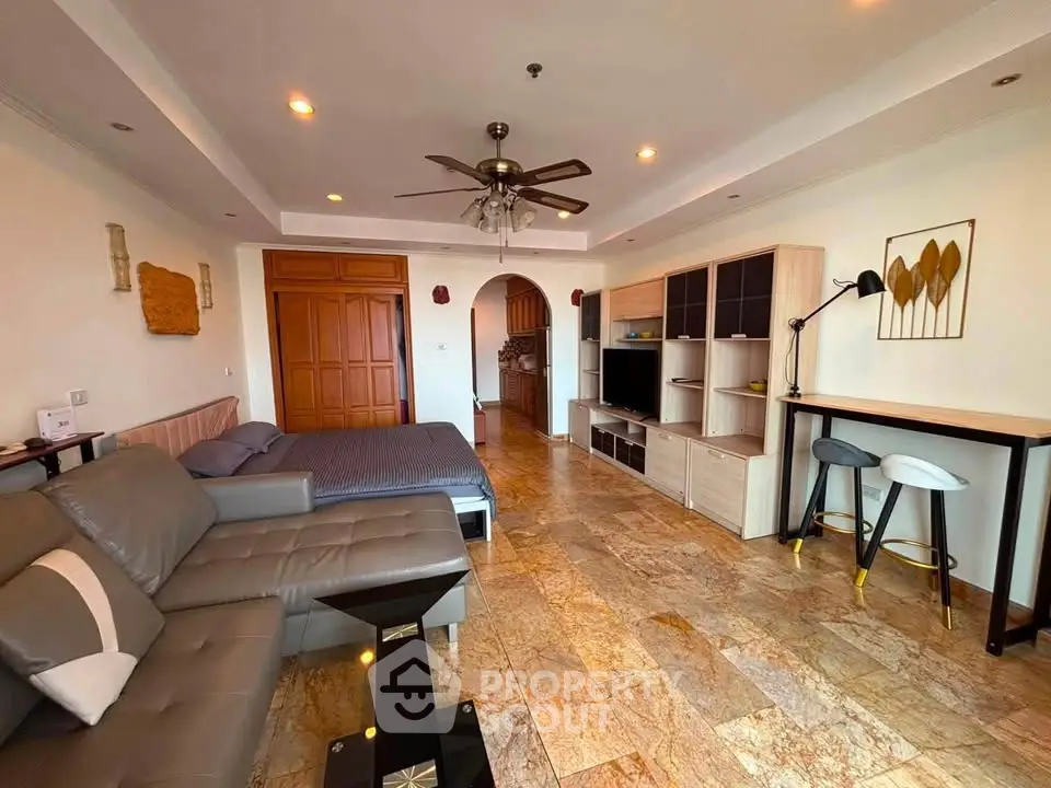 Spacious living room with modern decor and cozy seating area
