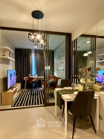 Modern living room with stylish decor and open layout, featuring a dining area and cozy seating.