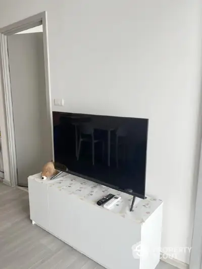 Modern living room with sleek TV setup and minimalist decor