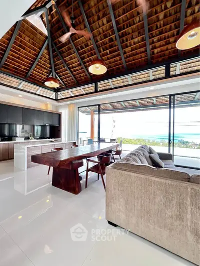 Luxurious open-plan living room with ocean view and modern kitchen