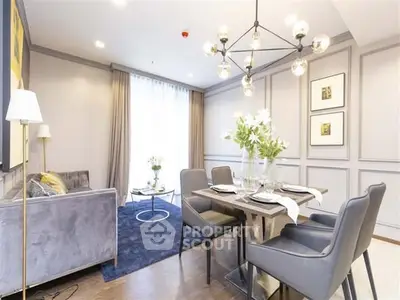 Elegant living room with modern dining area and stylish chandelier