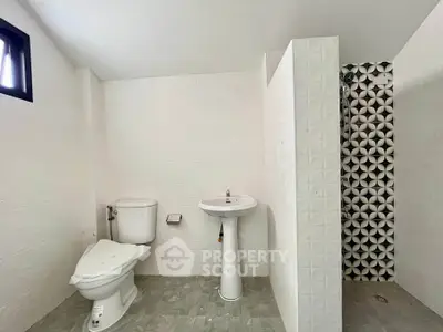 Modern bathroom with stylish shower tiles and minimalist fixtures