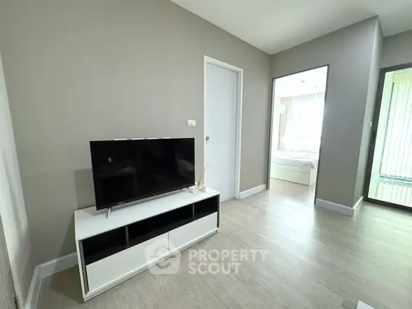 Modern living room with sleek TV stand and neutral decor
