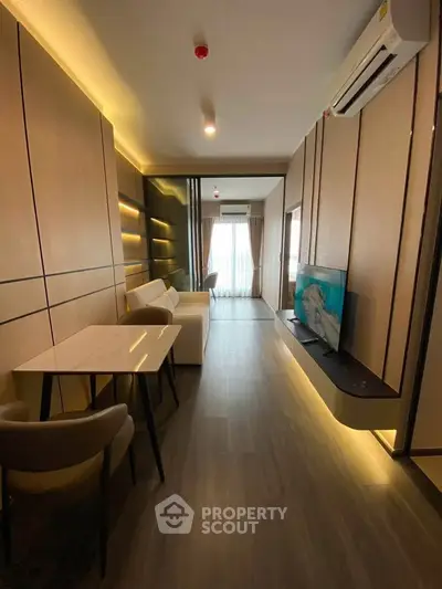 Modern living room with sleek design, ambient lighting, and stylish furniture in a contemporary apartment.