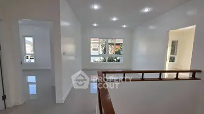 Spacious and bright interior with modern finishes and large windows.