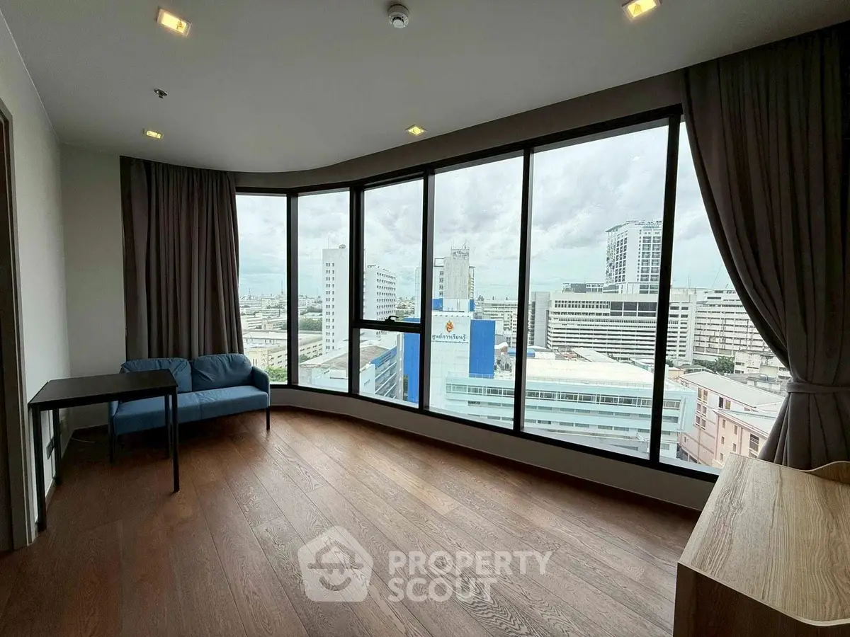 Spacious corner unit with panoramic city view and modern interior design.
