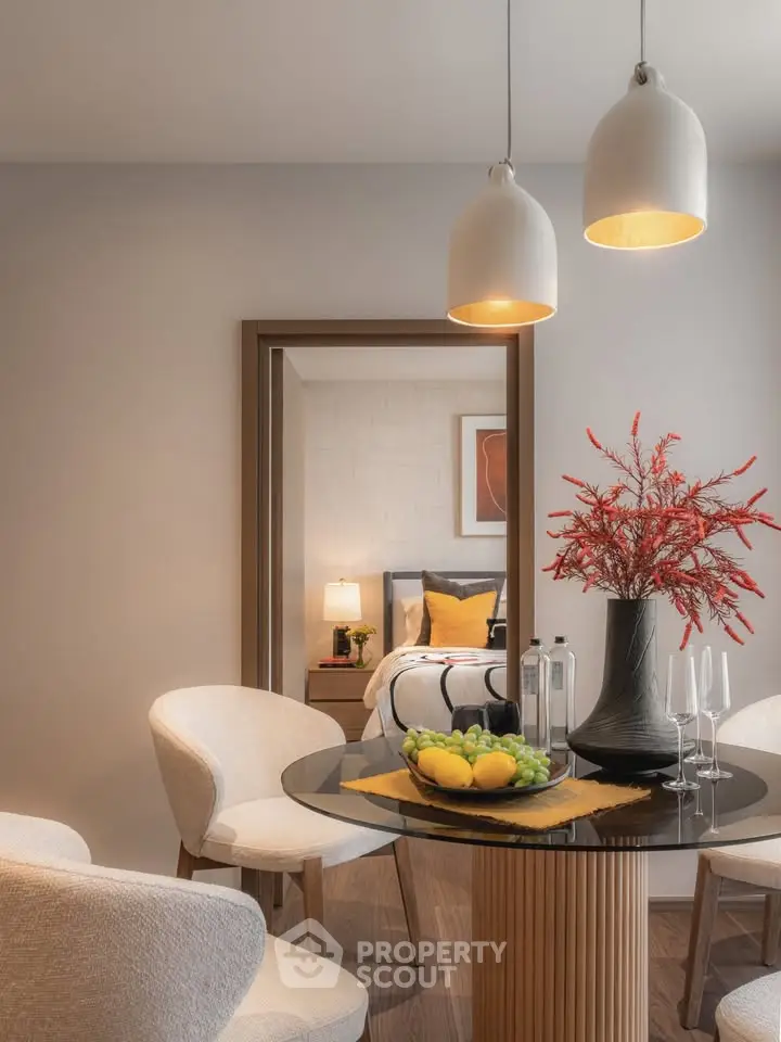 Stylish dining area with modern decor and a glimpse into a cozy bedroom