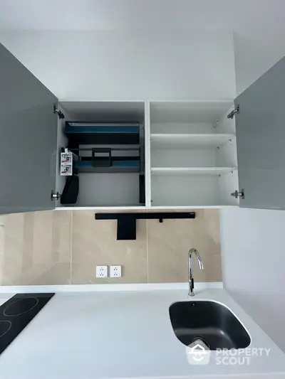 Modern kitchen with sleek cabinetry and integrated appliances