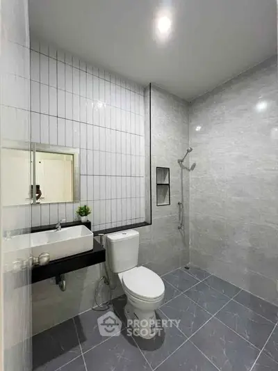 Modern bathroom with sleek tiles and contemporary fixtures