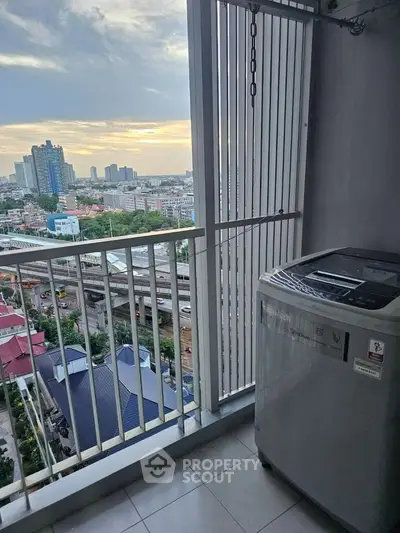 High-rise balcony with city view and washing machine, perfect for urban living.