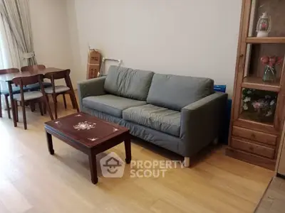 Cozy living room with stylish sofa and elegant wooden furniture