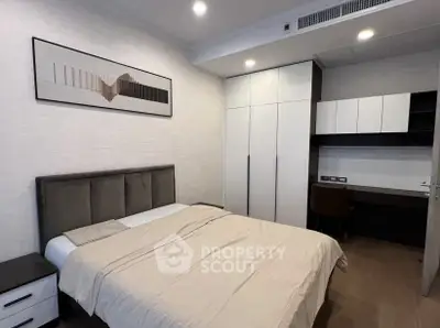 Modern bedroom with stylish decor and built-in storage solutions