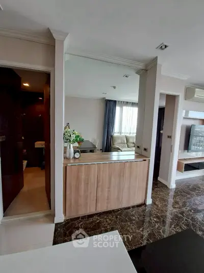 Modern living room with elegant marble flooring and stylish decor
