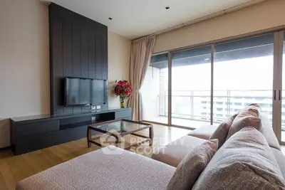 Spacious living room with modern decor and large balcony view.