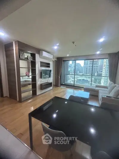 Spacious modern living room with city view and elegant furnishings