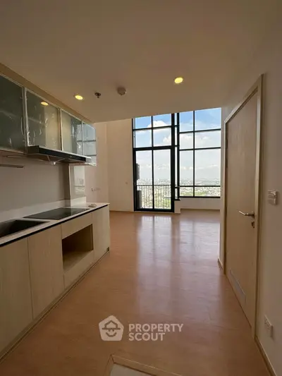 Spacious open kitchen with stunning city view and large windows