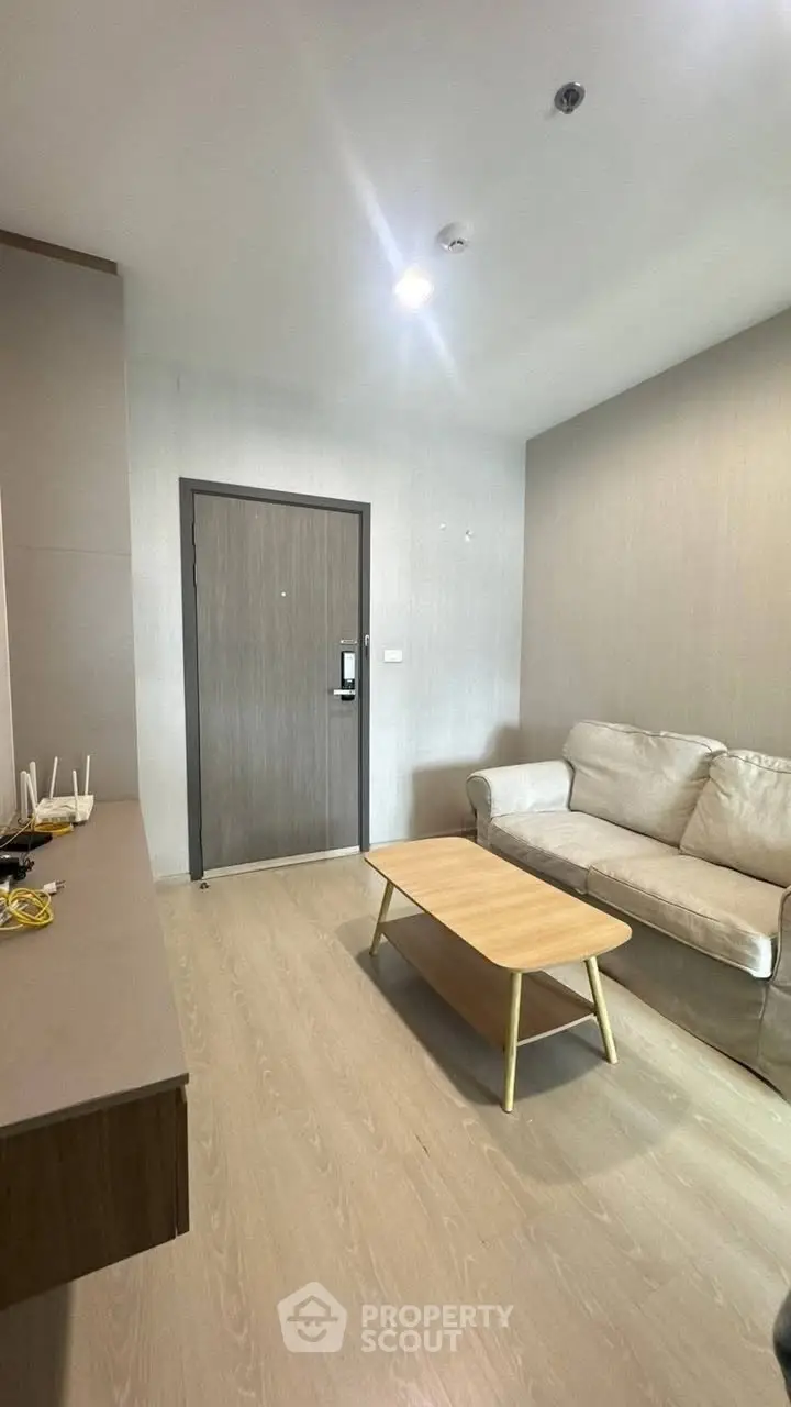 Modern living room with cozy sofa and wooden coffee table