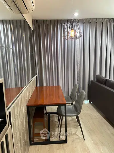 Modern living room with stylish dining area and contemporary lighting