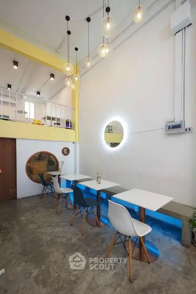 Modern cafe interior with stylish lighting and minimalist furniture