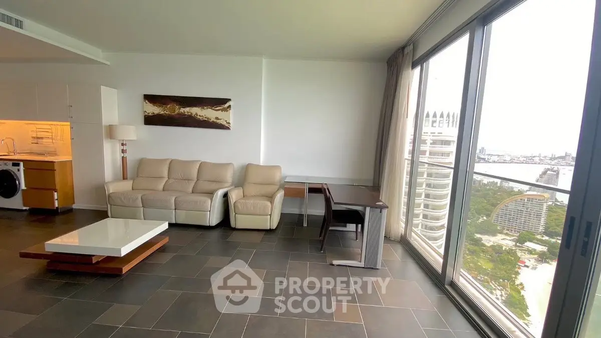 Spacious modern living room with stunning city view and elegant furnishings